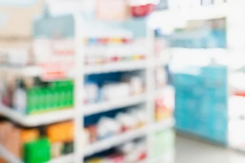 Background of blurred qualified pharmacy abstract background with drugs on shelf Foto stock