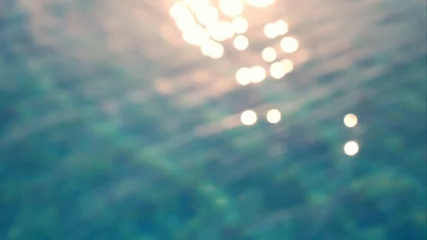 Background of the blurred undulating surface pool water. The rays of the sun Stock Footage 91598800