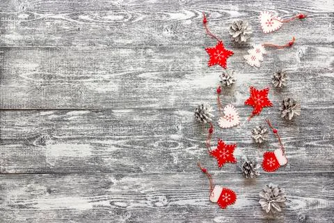 Background with a border of red Christmas decorations and white painted pine  Stock Photos