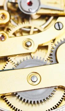 Background from brass clockwork of vintage clock Stock Photos