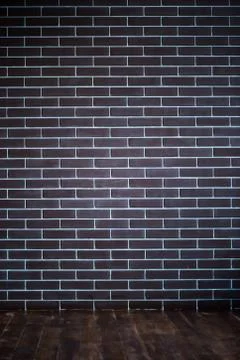 Background of a brick dark wall, tile texture with a smooth pattern. Stock Photos