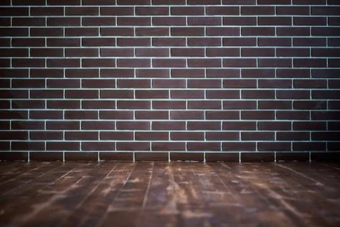 Background of a brick dark wall, tile texture with a smooth pattern. Stock Photos