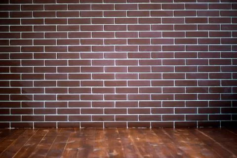 Background of a brick dark wall, tile texture with a smooth pattern. Stock Photos