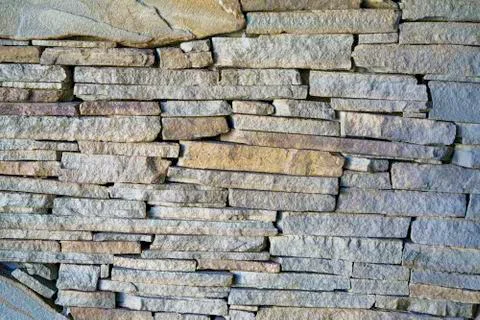 Background of brick stone wall texture. Close up image. Stock Photos
