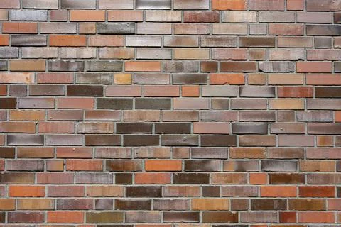 Background of a brick wall with different shades of red Stock Photos