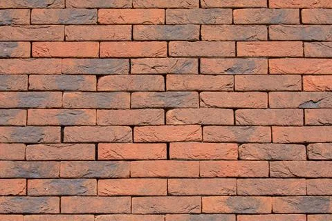 Background brick wall without cement joints Stock Photos