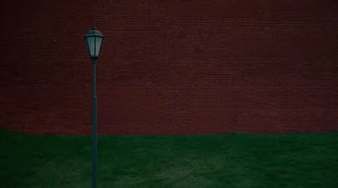 Background, brickwork, wall, lantern, the wind rustles the grass Stock Footage 55806115