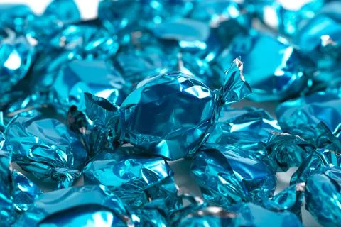 A Background of Bright Blue Wrapped Candy Stock Photos