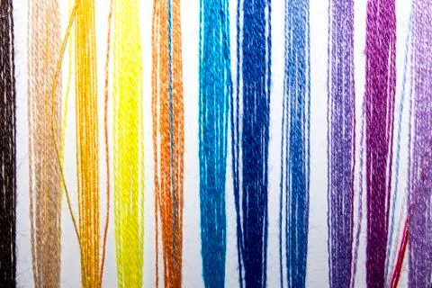 Background of bright colored embroidery threads. Stock Photos