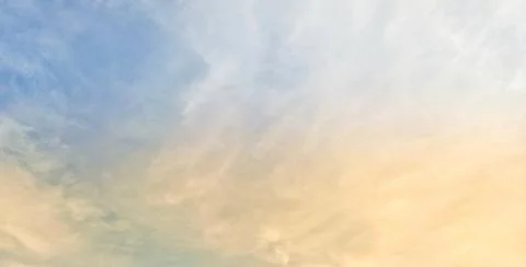 Background of bright evening sky and background of thin clouds, sky clouds. Stock Photos