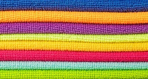 Background of bright microfiber napkins folded in a stack Stock Photos