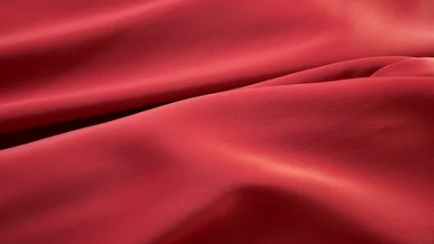 Background from bright satin fabric. close-up. Red color. fabric texture. Видео 104608589