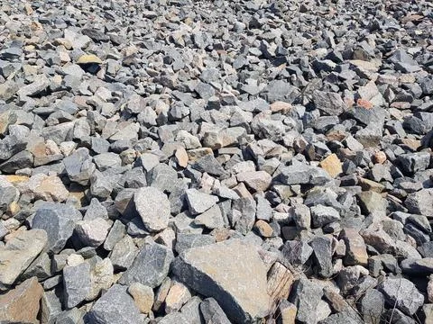 Background of broken stones close-up. Broken gravel texture Stock Photos