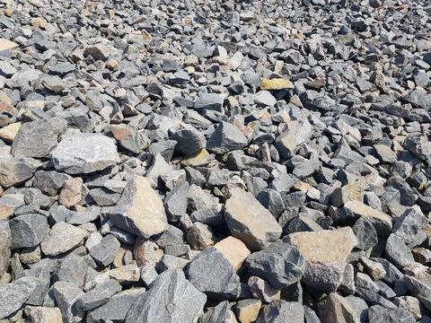 Background of broken stones close-up. Broken gravel texture Stock Photos