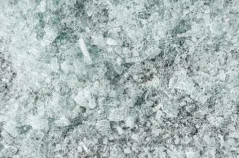 Background of broken tempered glass into small pieces. Stock Photos