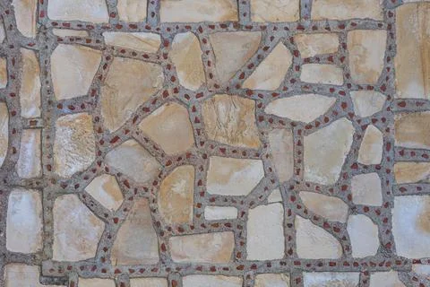 Background of brown-gray stone wall  . Pattern of slate wall texture and back Stock Photos