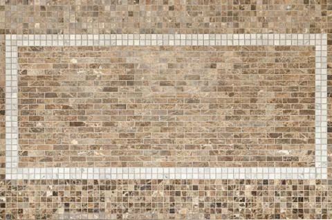 Background of brown mosaic tile on decorative wall. Stock Photos