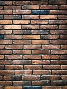 Background of brown vintage brickwork with light vignetting Stock Photos