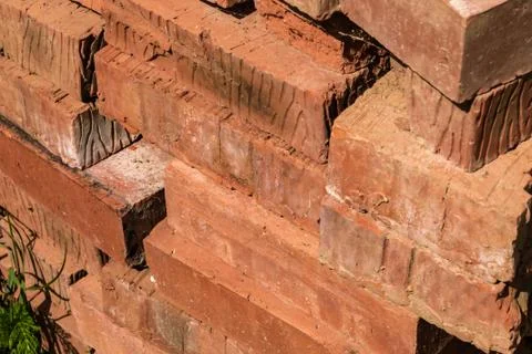 Background building stack of bricks red terracotta natural materials traditio Stock Photos