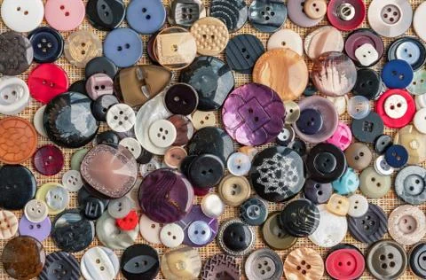 Background of buttons for clothes. Buttons of different shapes and sizes. Stock Photos