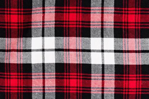 Background in a cage white with red and black fabric close-up Stock Photos