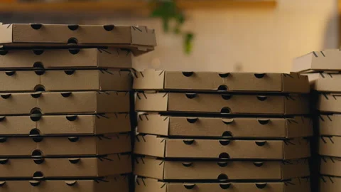 Background from cardboard pizza boxes. smooth camera movement. Large stacks Stock Footage 252386507