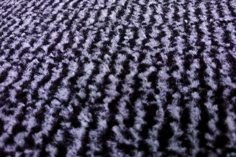 The background of the carpet made of wool with a small pile of white and blac Stock Photos