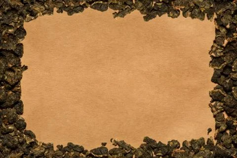 Background of cartboard with a frame made of tea Stock Photos
