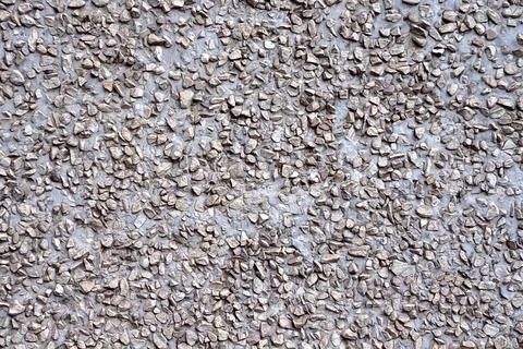 Background cement wall with small crushed stone 写真素材