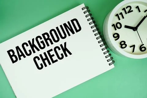 Background Check text with alarm clock flat lay on green background Foto stock