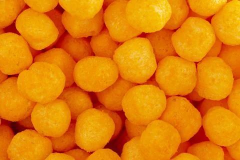 A Background of Cheese Covered Ball Snacks Foto stock