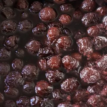 Background of cherry jam.Close up of simmering homemade cherry jam Stock Photos