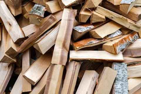 Background from chopped firewood. Stock Photos