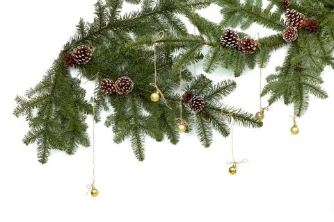 Background with christmas tree branches and hanging glitter balls. Stock Photos