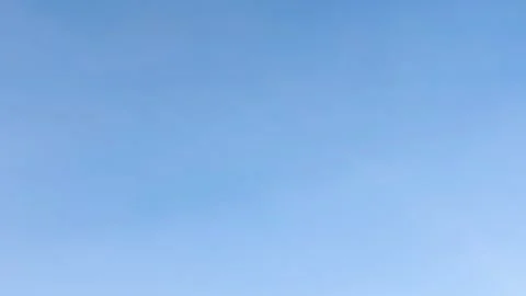 A background with a clear blue sky and soft clouds Video stock 330606354