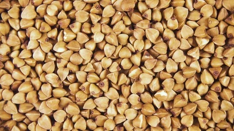 Background of clockwise rotating grain cereals top view Stock-Footage 99770823