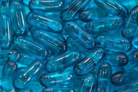 Background - close up of countless blue colourful medicine  pills Stock Photos