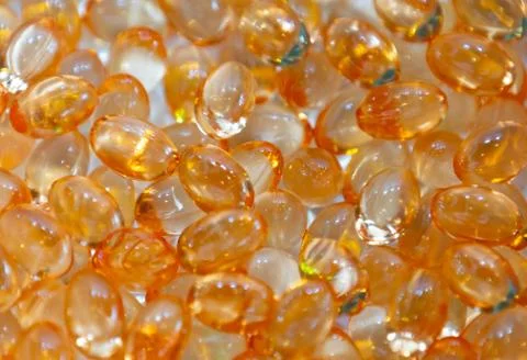 Background - close up of countless colourful orange medicine  pills Stock Photos