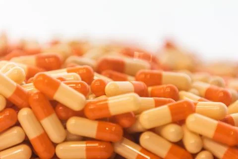 Background - close up of countless colourful orange medicine  pills Stock Photos