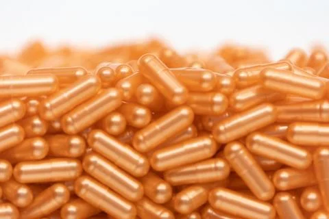Background - close up of countless colourful orange medicine  pills Stock Photos