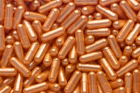 Background - close up of countless colourful orange medicine  pills Stock Photos