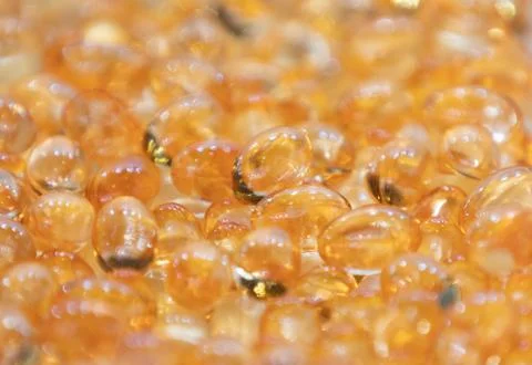 Background - close up of countless colourful orange medicine  pills Stock Photos