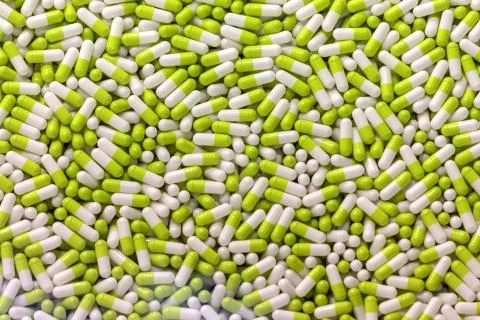 Background - close up of countless green and white colourful medicine  pills Stock Photos