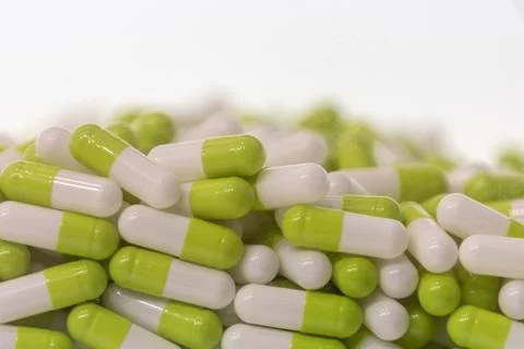 Background - close up of countless green and white colourful medicine  pills Stock Photos