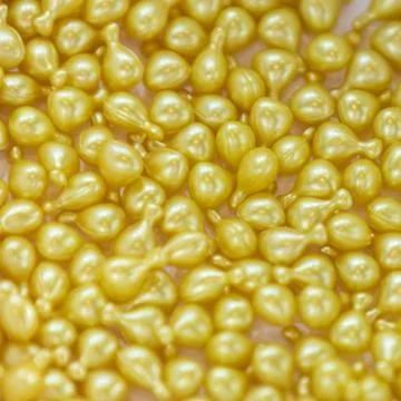 Background - close up of countless yellow colourful medicine  pills Stock Photos