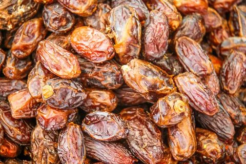 Background with close up of dried fruit - brown dates on a stall Stock Photos