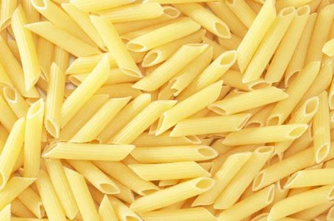 Background with closeup of macaroni pasta Stock Photos