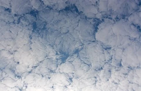 Background of clouds against blue sky. Stock Photos