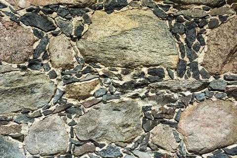 Background of a cobblestone wall, the texture of a stone wall, the texture of Stock Photos