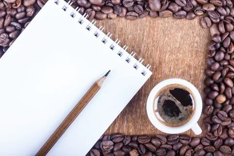 Background of coffee and Notepad on the table top view Stock Photos